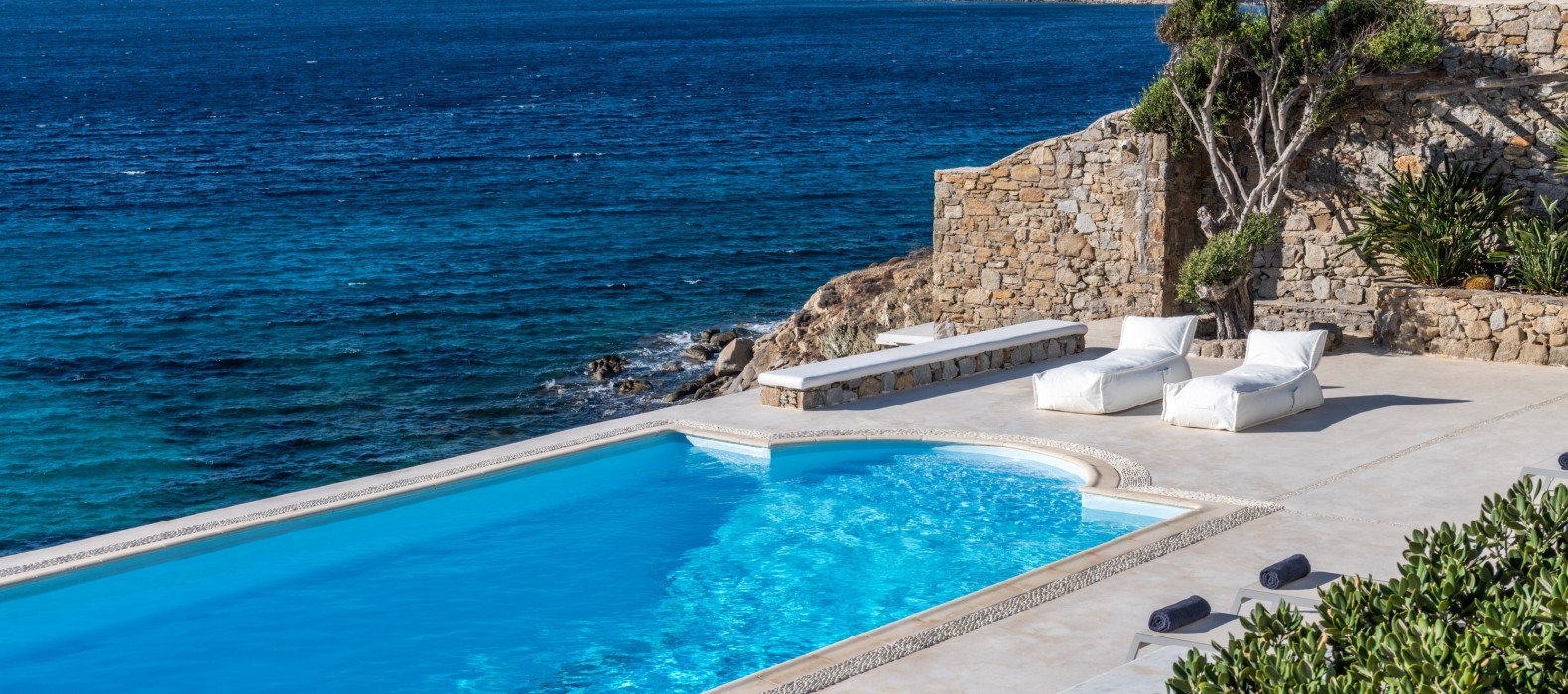 Exterior pool area with sea view of Villa Dryope in Mykonos