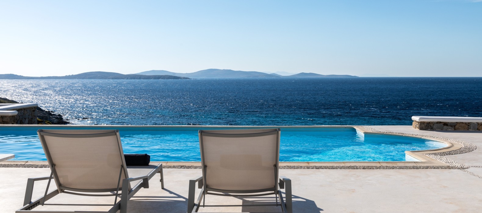 Exterior area with sun loungers of Villa Dryope in Mykonos