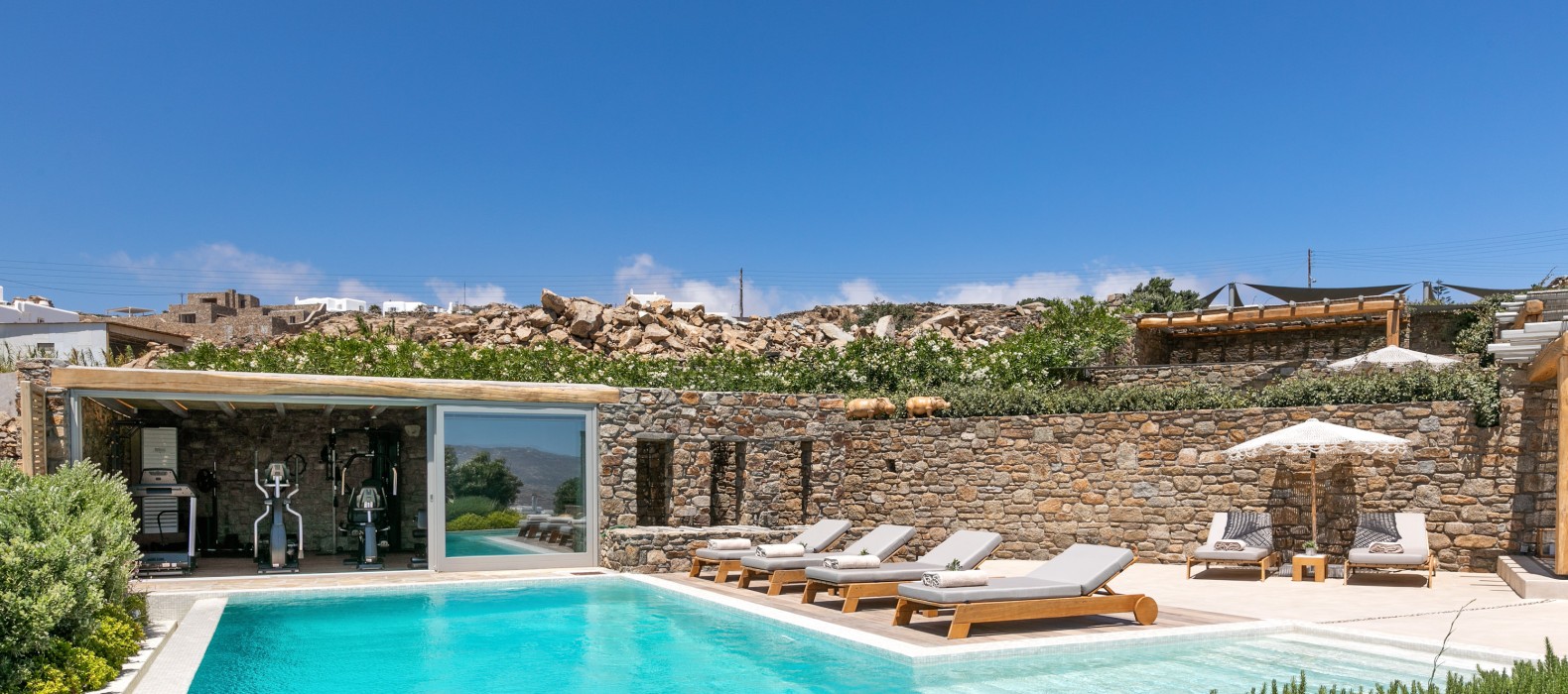 Exterior area with gym and pool of Villa Elegant Elana in Mykonos