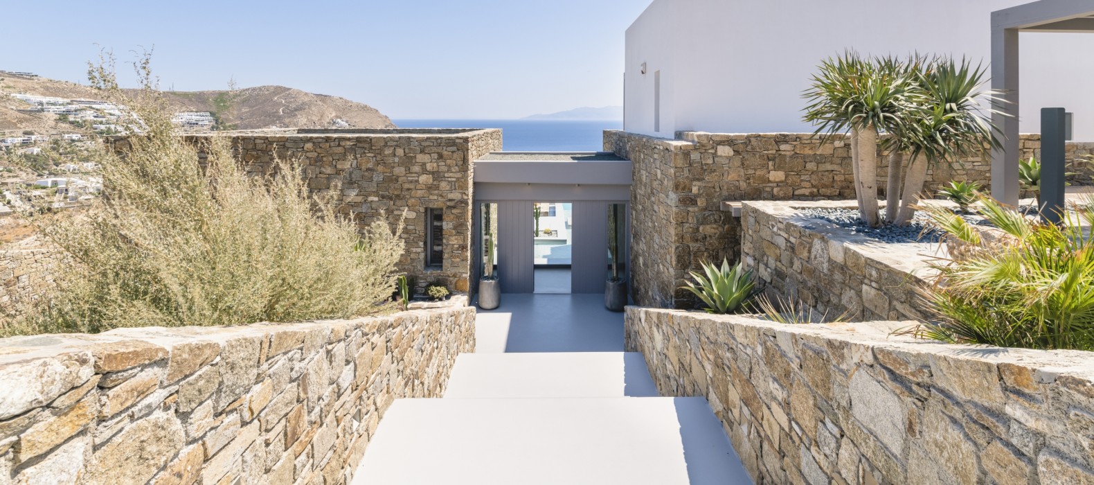 Exterior entrance view of Villa Infinita in Mykonos