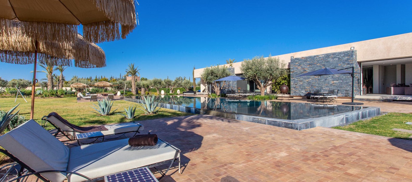 Pool area with sun loungers of Villa Yasmina in Marrakech