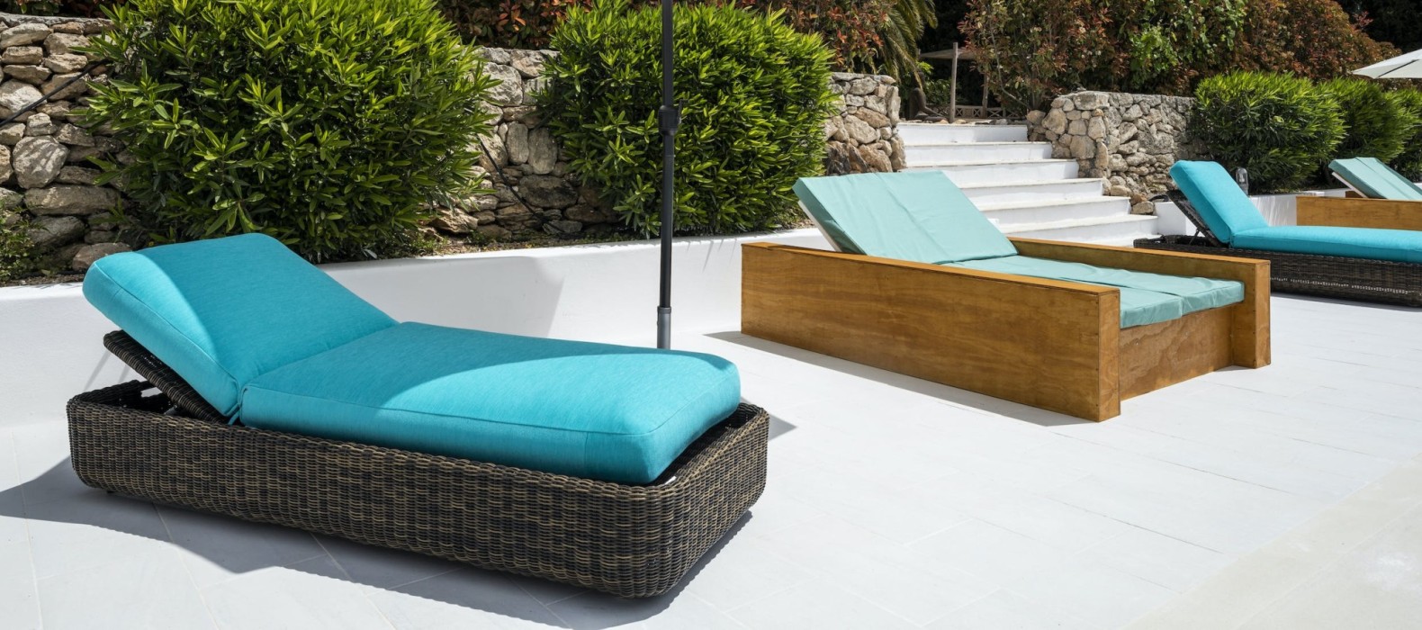 Sun loungers at the pool of Villa Evenfall in Ibiza