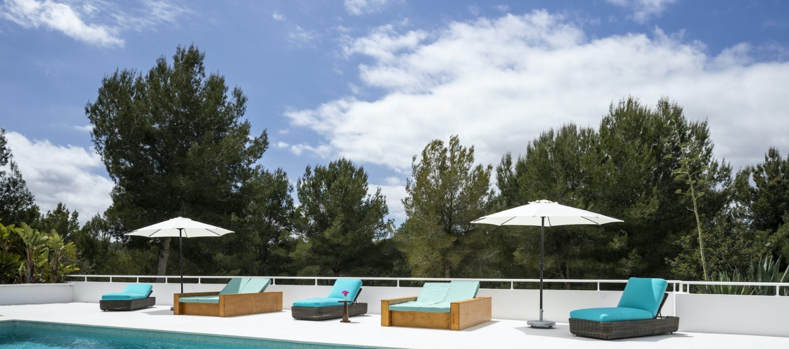 Pool area with sun loungers of Villa Evenfall in Ibiza