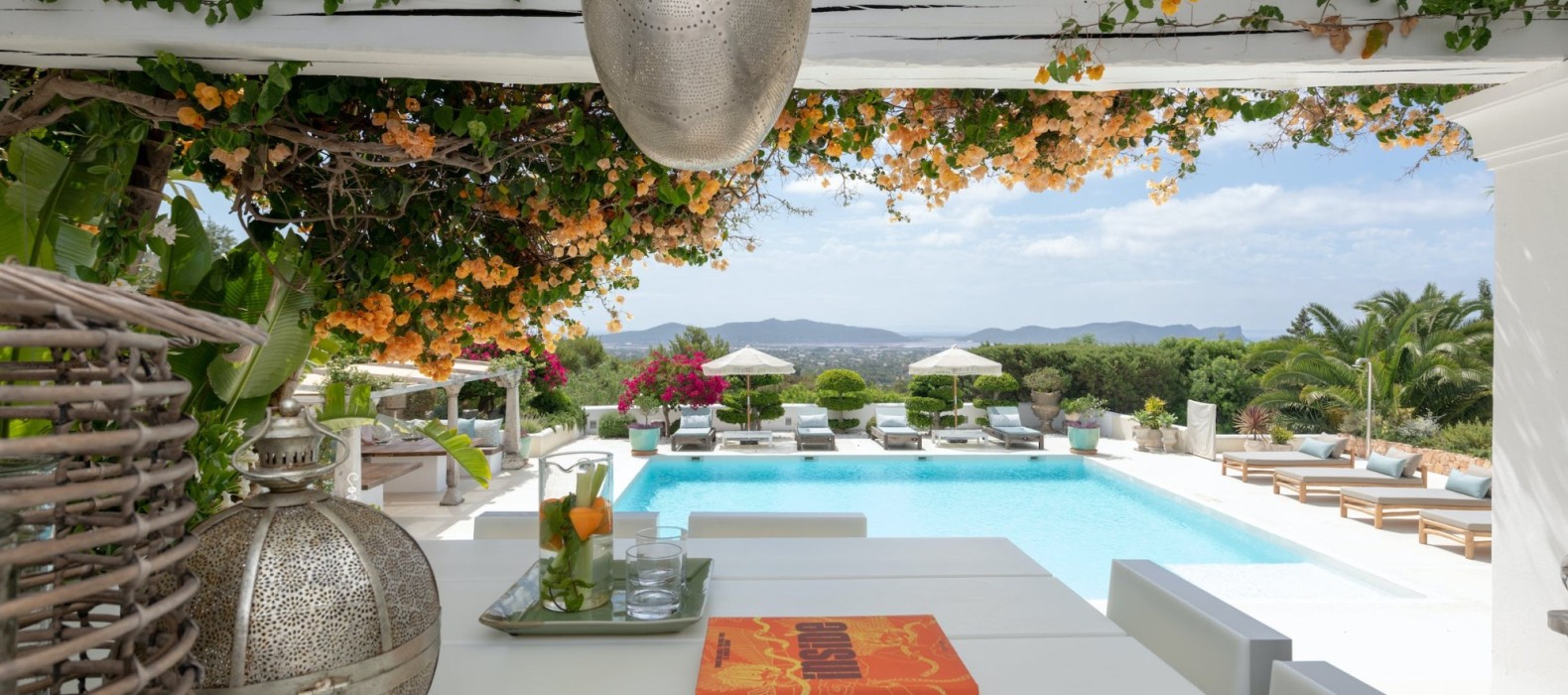 Exterior dining table with pool view of Villa Glamour in Ibiza