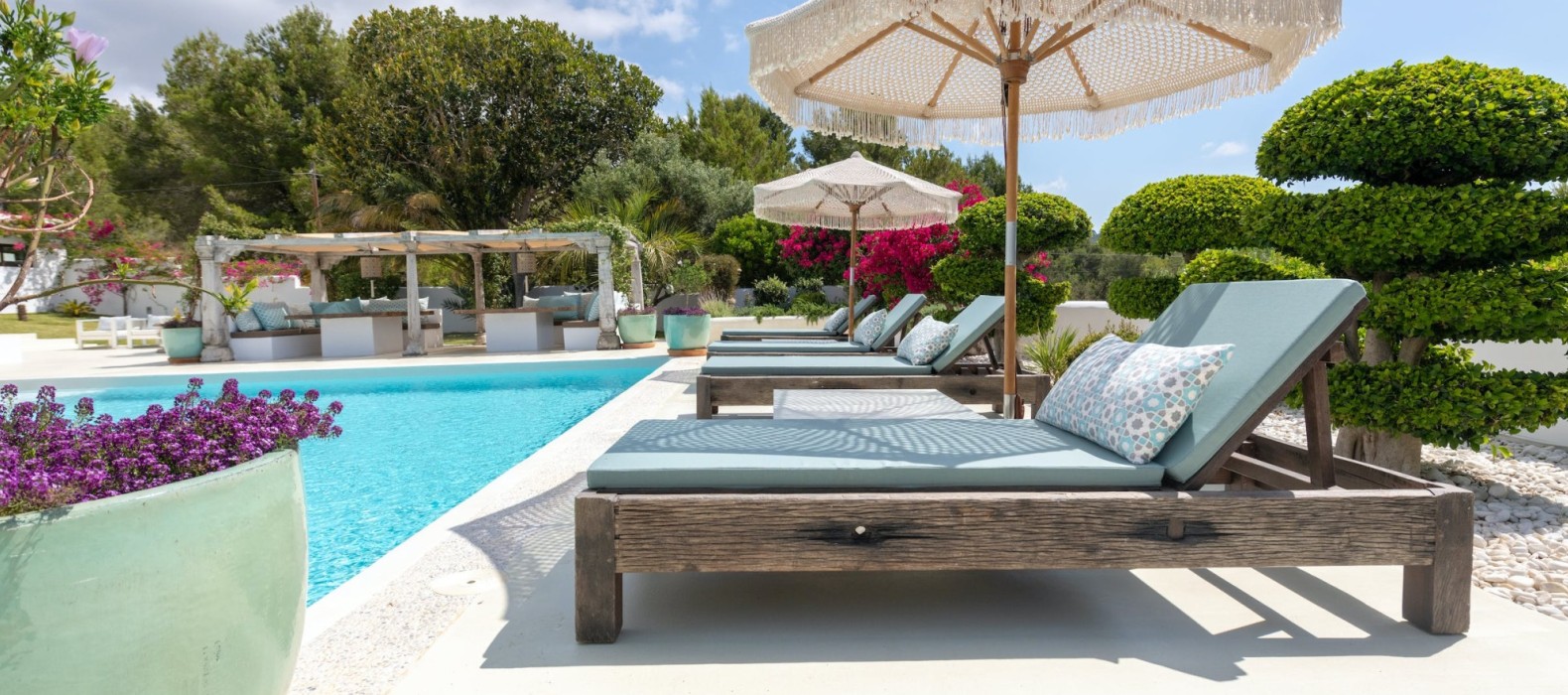 Sun loungers at the pool of Villa Glamour in Ibiza