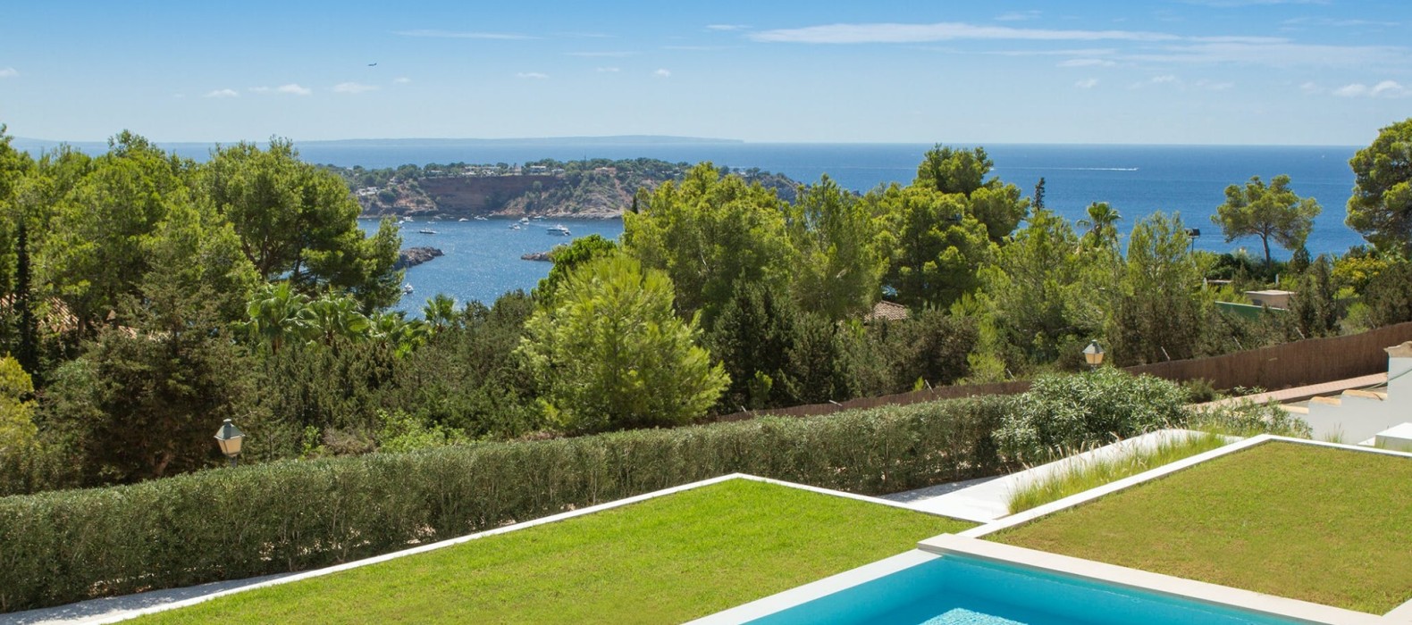 Exterior area with pool and sea view of Villa Kahil Ibiza