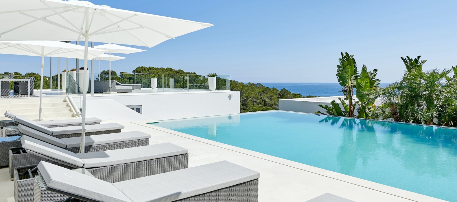 Exterior pool area with sea view of Villa La Colina in Ibiza