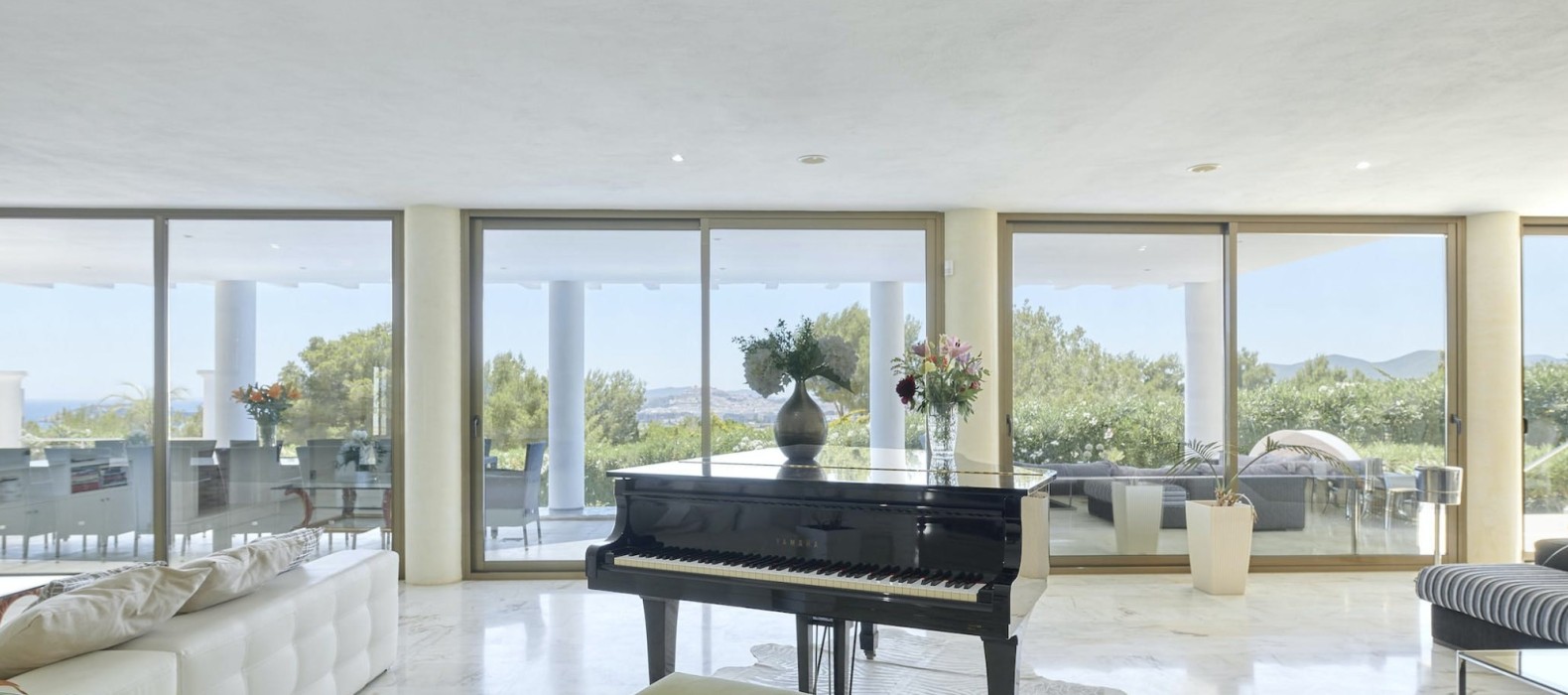 Living room with piano of Villa Riva Alto in Ibiza