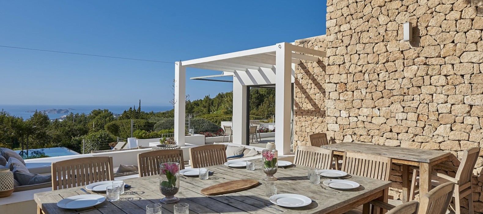 Exterior dining pool of Villa Rivianna in Ibiza