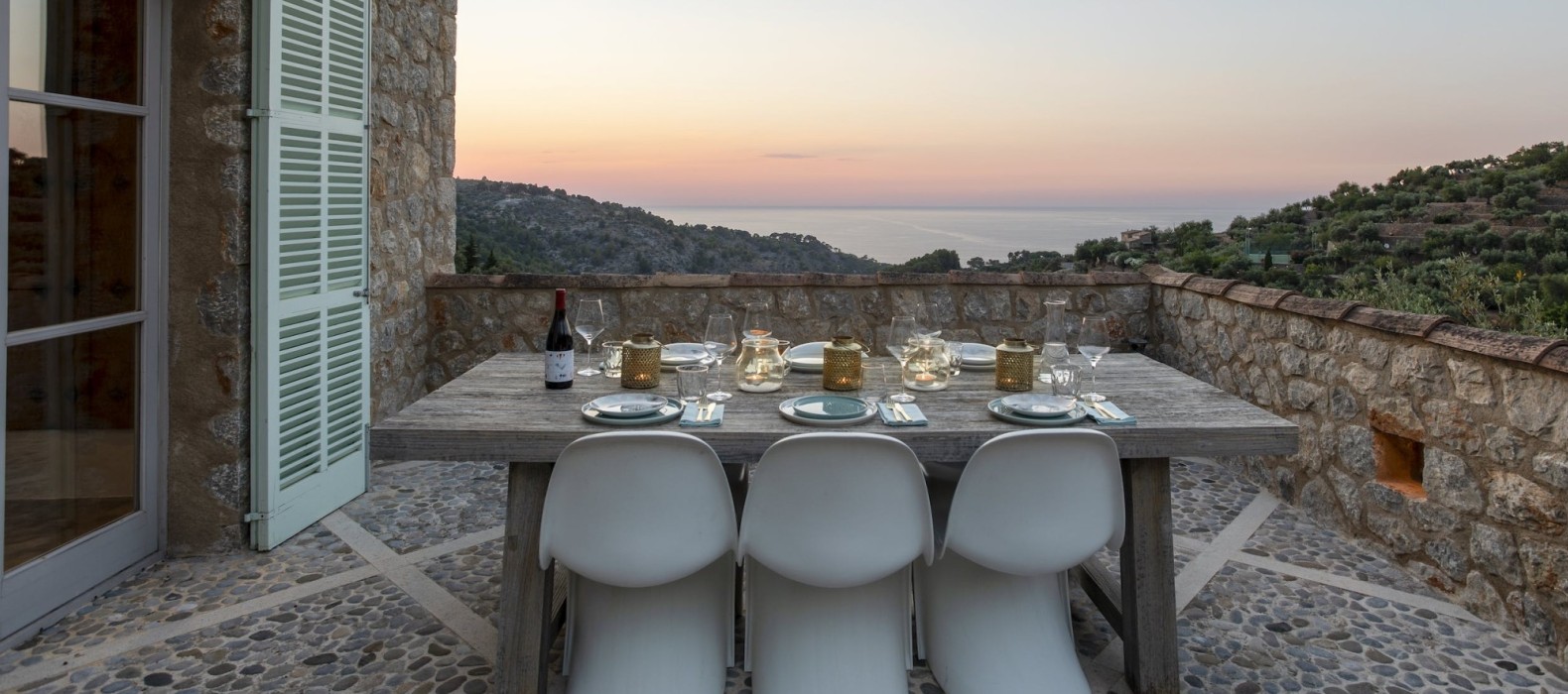 Exterior dining area with sea view of Casa Karma in Mallorca